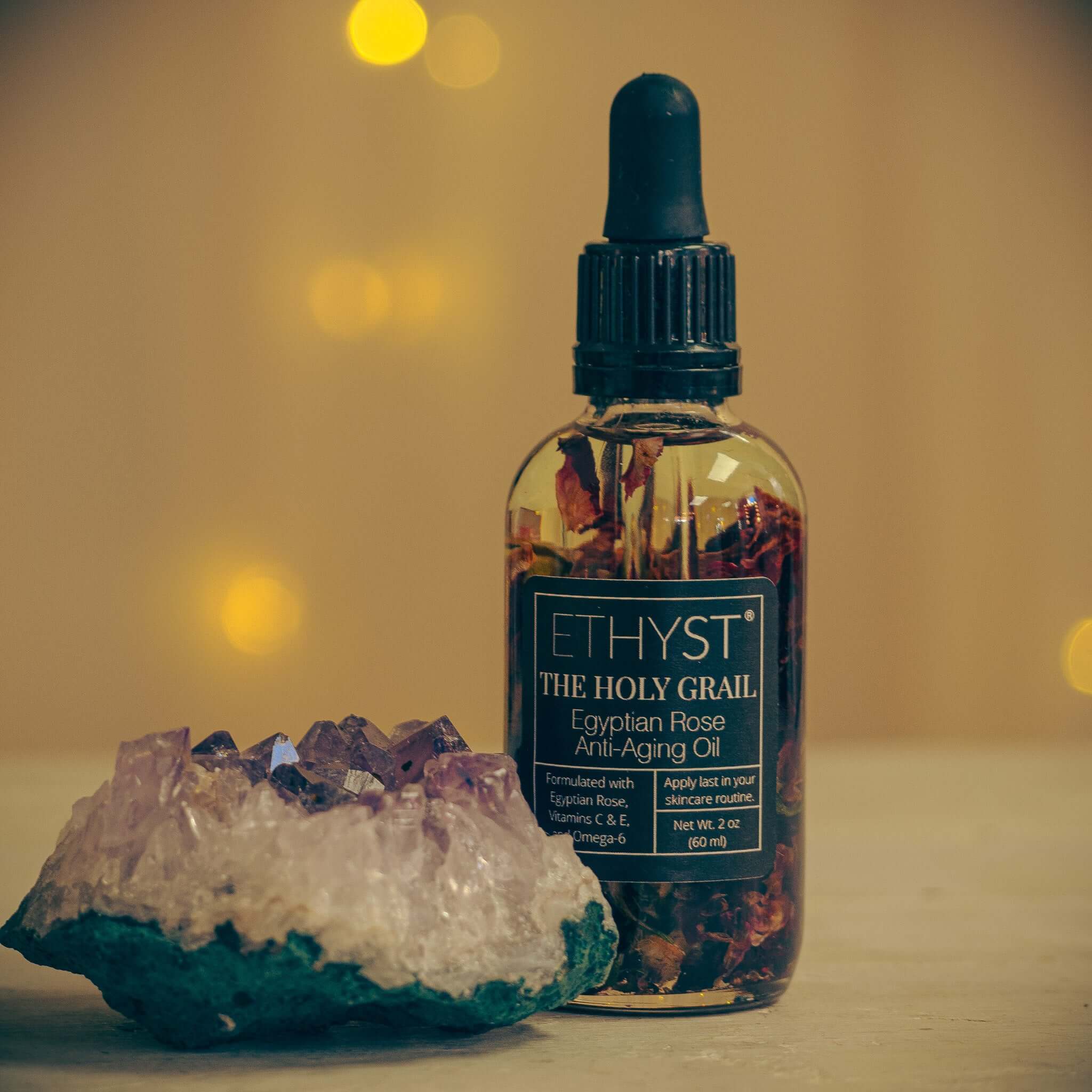 ETHYST® The Holy Grail™ Egyptian Rose Infused Anti-Aging Facial Oil contains Vitamin E that helps aid in acne scarring, hyperpigmentation, and prevents aging and wrinkles. Found at Champagne Apothecary in Westfield, Massachusetts on School Street. It is an enchanting small town shop specializing in professional skincare and self-care gifts.